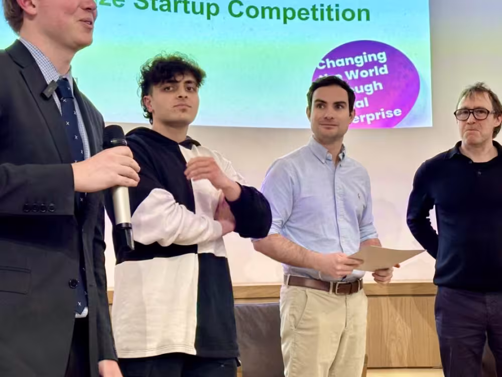 Presenters talking at conference