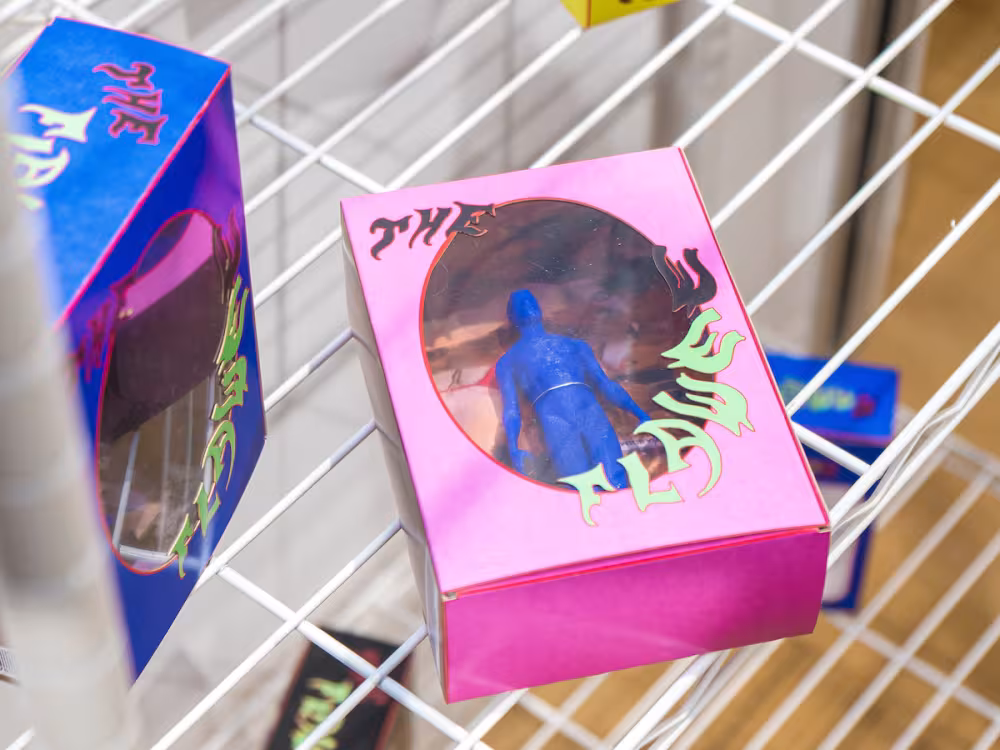 Artwork featuring plastic toys on a shelf