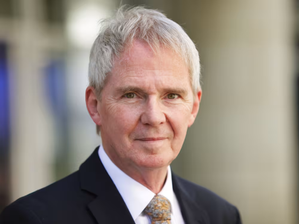 Prof Sir NIgel Shadbolt, man with white hair in grey suit with orange tie