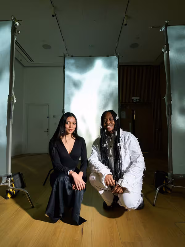 Two students with display