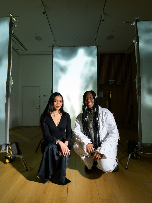 Two students with display