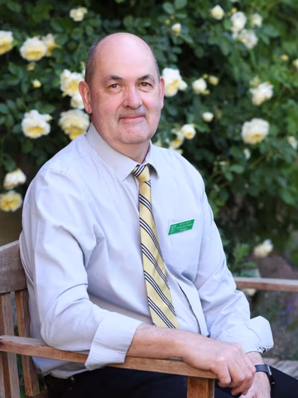 Man in tie sitting on bench