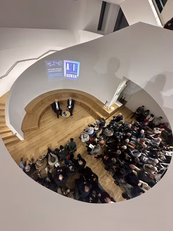 Audience watching speakers on stage