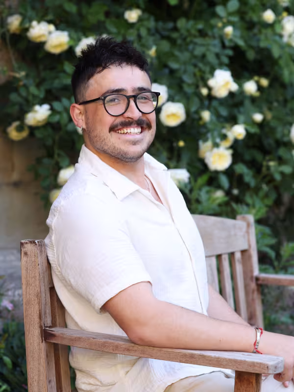 man in white shirt with glasses