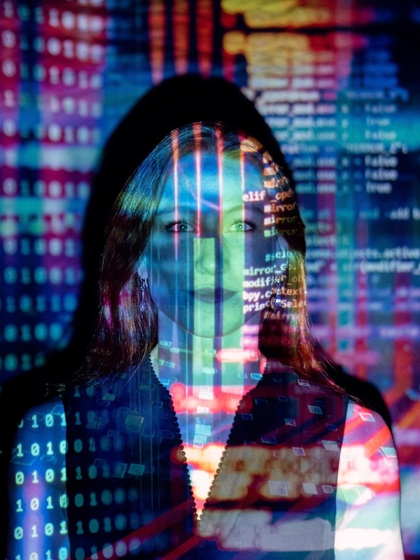 woman standing with colourful graphics across face