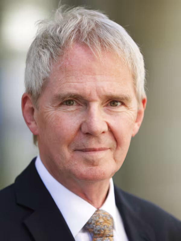 Prof Sir NIgel Shadbolt, man with white hair in grey suit with orange tie