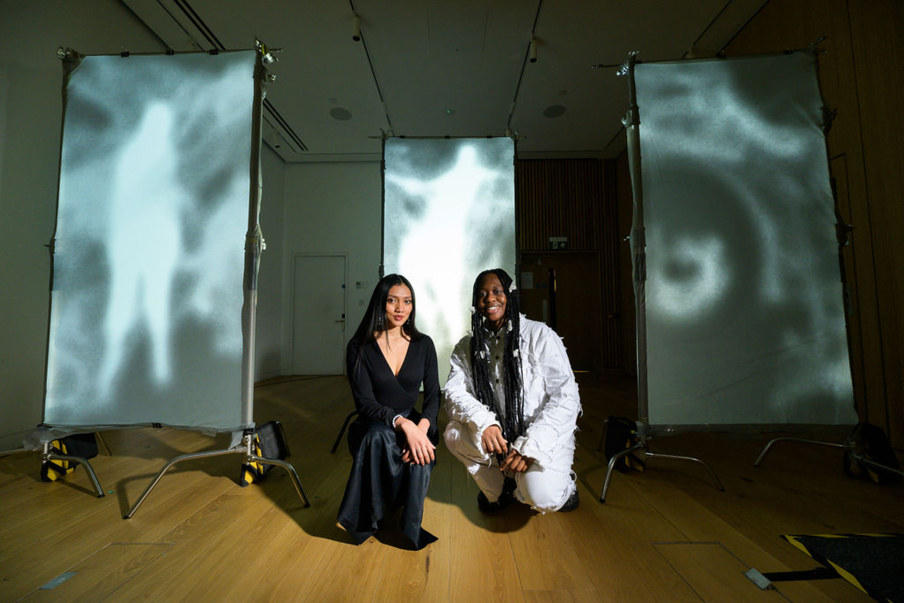 Two students with display