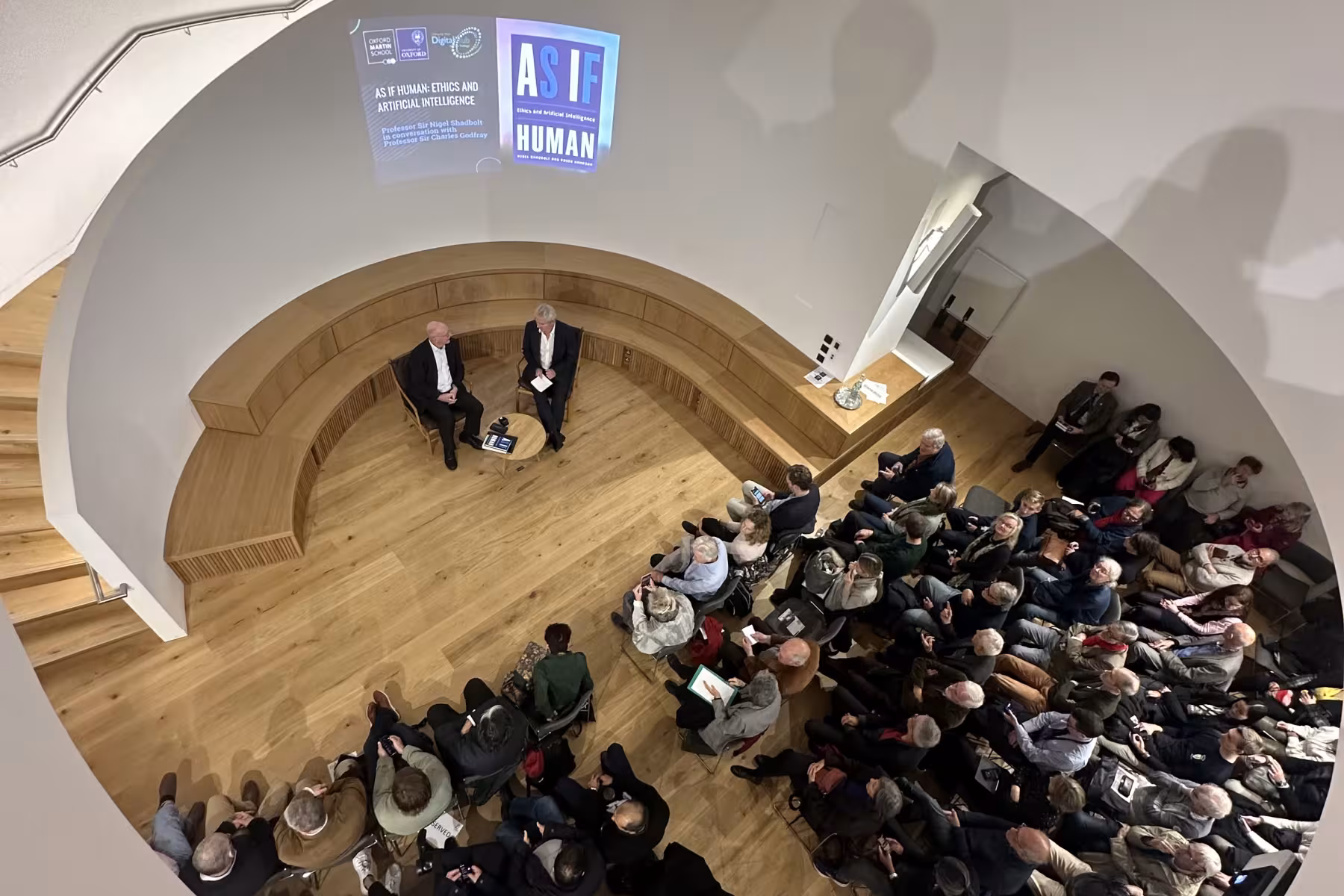 Audience watching speakers on stage